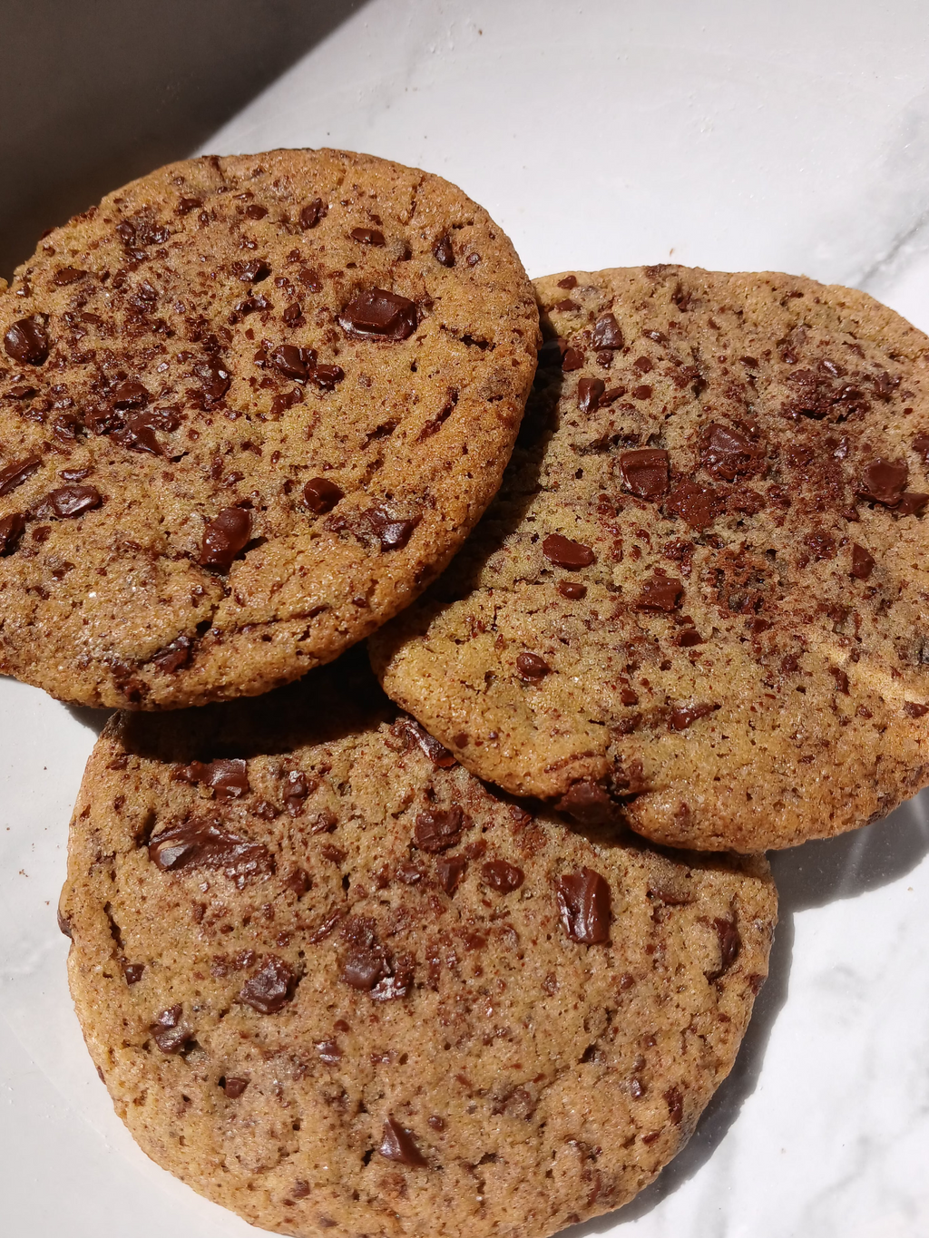 Chocolate chip cookies on a marble surface