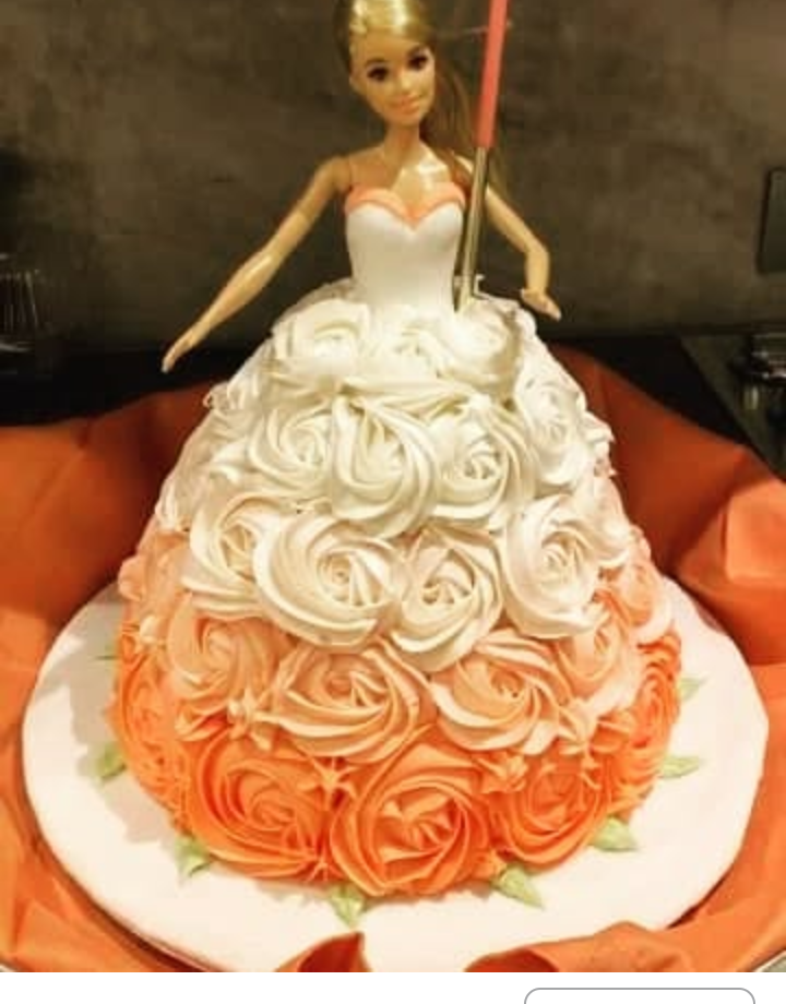 Barbie Doll cake with pink and white frosting. 3D barbie cake.