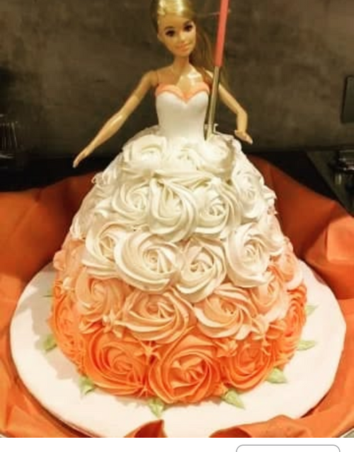 Barbie Doll cake with pink and white frosting. 3D barbie cake.