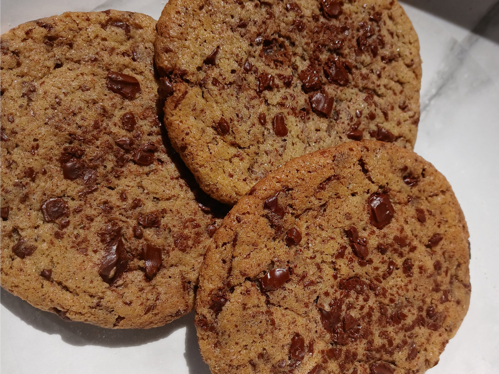 browned butter chocolate chip cookies on a white surface