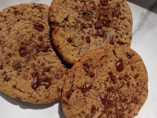 browned butter chocolate chip cookies on a white surface